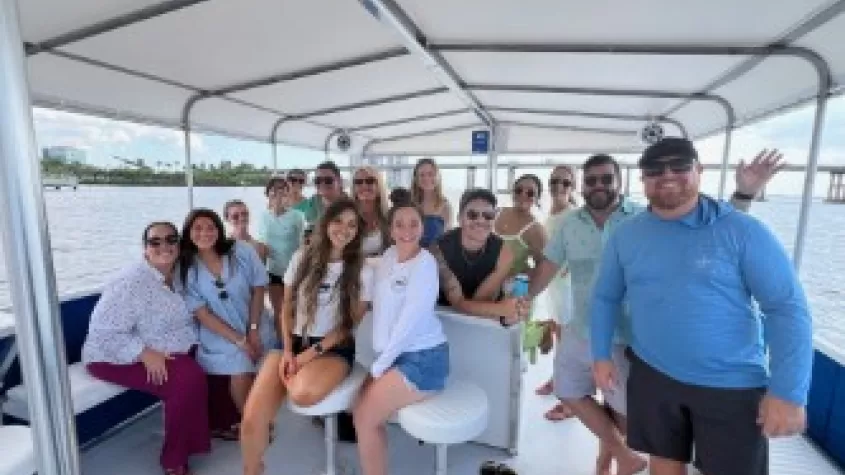 Co-workers enjoying boat