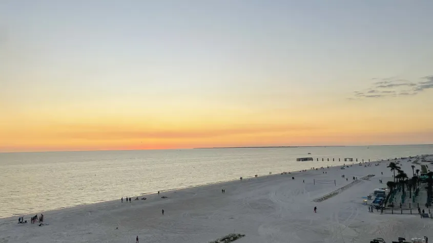 sunset of yellow and blue skies overlooking the beach