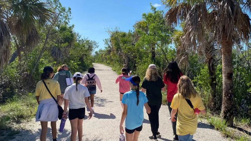 People walking on a tour of CROW outside