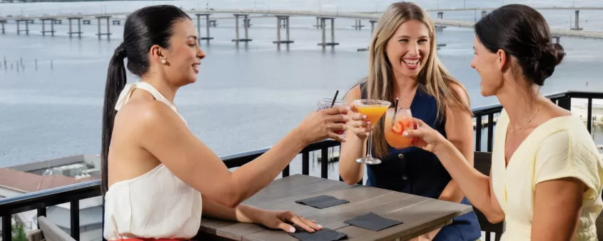 Women enjoying downtown rooftop bar