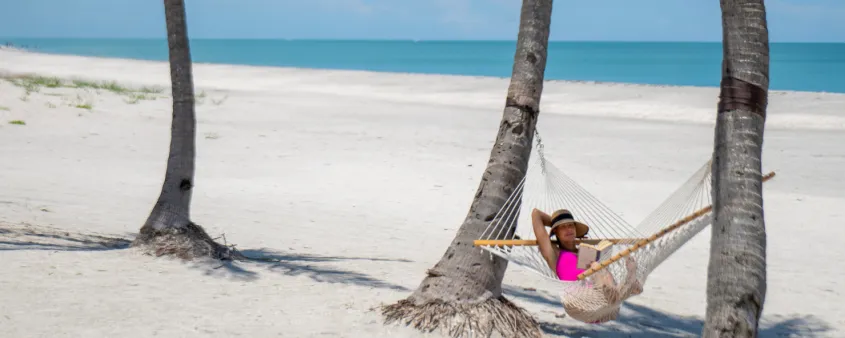 A woman relaxes in a hammock on Captiva Island