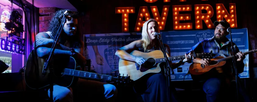 A songwriter performs at the Island Hopper Songwriter Festival
