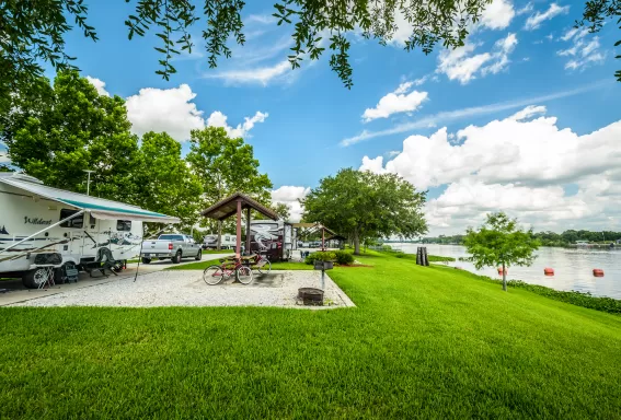 campground with camper by river 