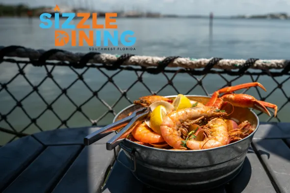 A bowl of shrimp on a table during Sizzle Dining Month in September